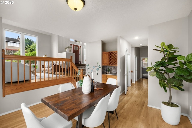 4025 Horton Rd, West Linn, OR 97068 - dining room featuring stairway, light wood finished floors, and recessed lighting