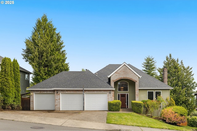 4025 Horton Rd, West Linn, OR 97068 - traditional-style home with an attached garage, a shingled roof, driveway, a front yard, and a chimney
