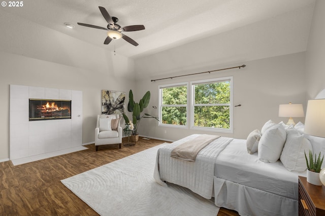 4025 Horton Rd, West Linn, OR 97068 - bedroom featuring wood finished floors, a fireplace, ceiling fan, and vaulted ceiling