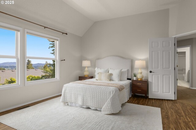 4025 Horton Rd, West Linn, OR 97068 - bedroom with vaulted ceiling and dark wood-style floors