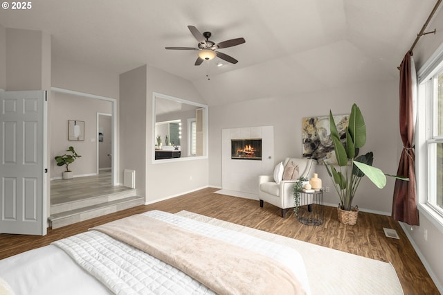 4025 Horton Rd, West Linn, OR 97068 - bedroom with wood finished floors, a tile fireplace, lofted ceiling, and ceiling fan