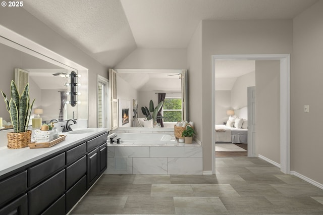 4025 Horton Rd, West Linn, OR 97068 - ensuite bathroom featuring a garden tub, vanity, and lofted ceiling