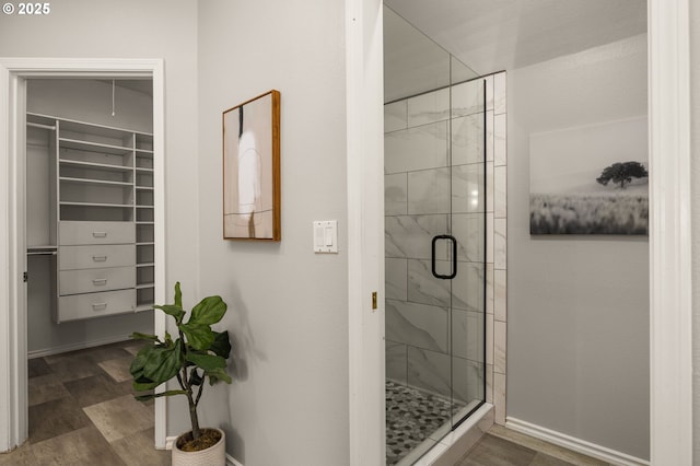 4025 Horton Rd, West Linn, OR 97068 - full bathroom with a shower stall, a walk in closet, and wood finished floors