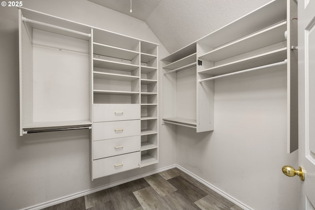 4025 Horton Rd, West Linn, OR 97068 - walk in closet featuring vaulted ceiling and dark wood finished floors