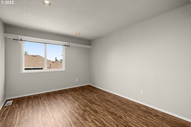 4025 Horton Rd, West Linn, OR 97068 - empty room with wood finished floors, a textured ceiling, and recessed lighting