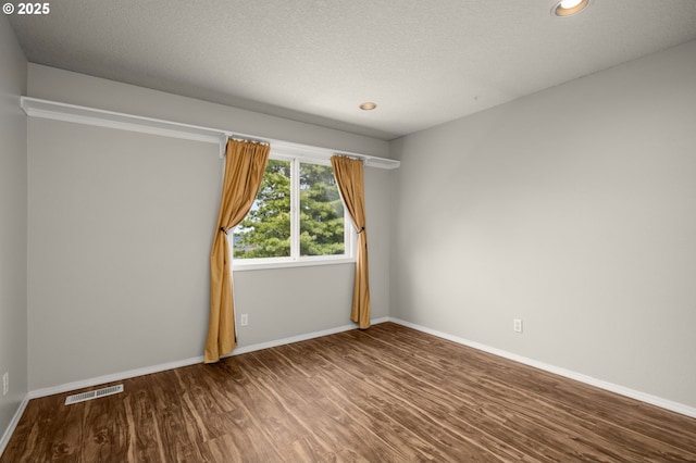 4025 Horton Rd, West Linn, OR 97068 - empty room with wood finished floors, recessed lighting, and a textured ceiling