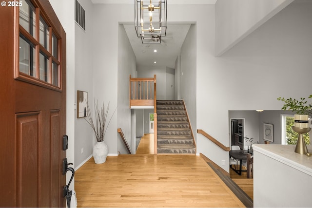 4025 Horton Rd, West Linn, OR 97068 - foyer entrance with a towering ceiling, wood finished floors, and stairs