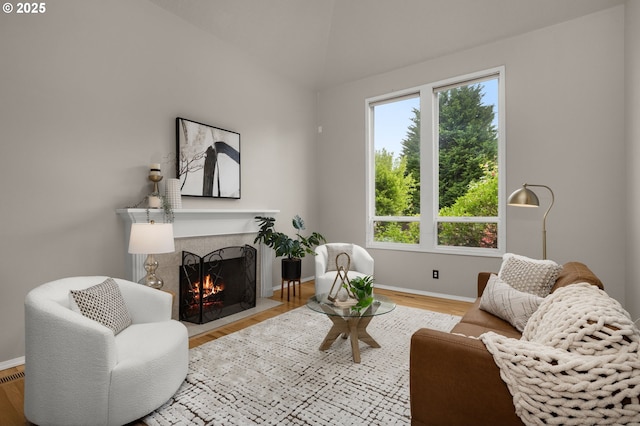 4025 Horton Rd, West Linn, OR 97068 - living area featuring a fireplace with flush hearth, wood finished floors, and lofted ceiling