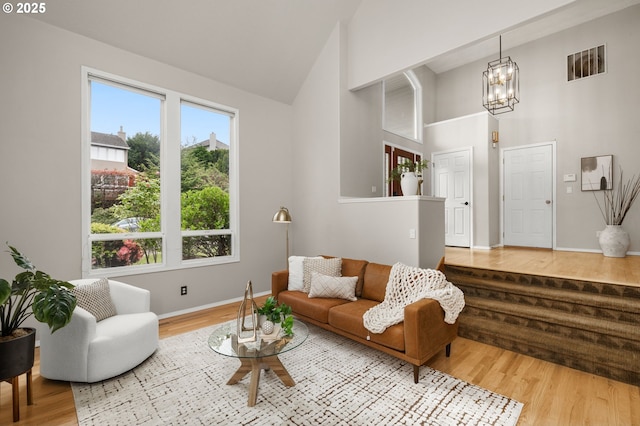 4025 Horton Rd, West Linn, OR 97068 - living room featuring a chandelier, high vaulted ceiling, and wood finished floors