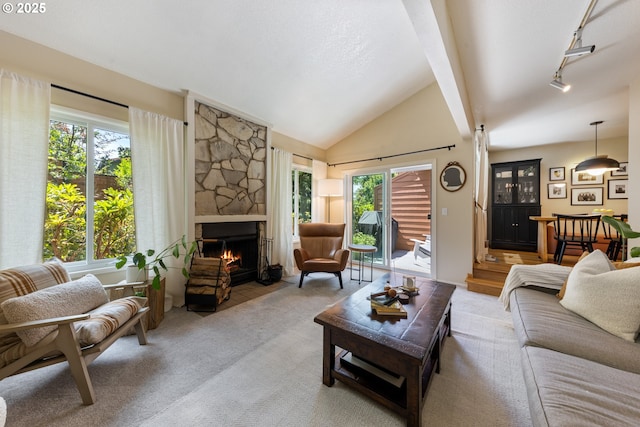 4300 Botticelli St, Lake Oswego, OR 97035 - carpeted living area featuring a fireplace, vaulted ceiling, and track lighting