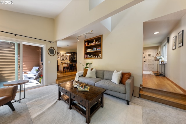 4300 Botticelli St, Lake Oswego, OR 97035 - living room featuring light carpet, recessed lighting, and a towering ceiling