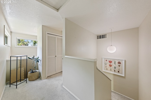 4300 Botticelli St, Lake Oswego, OR 97035 - corridor with an upstairs landing, carpet flooring, and a textured ceiling