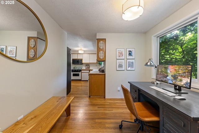 4300 Botticelli St, Lake Oswego, OR 97035 - home office with a textured ceiling and wood finished floors