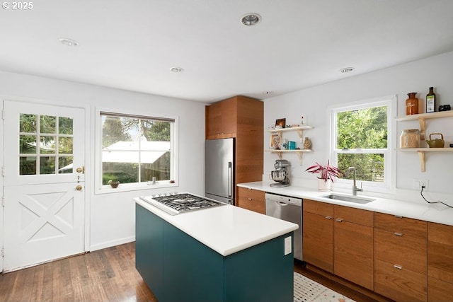 4541 NE 36th Ave, Portland, OR 97211 - kitchen featuring open shelves, stainless steel appliances, a sink, a kitchen island, and dark wood-type flooring
