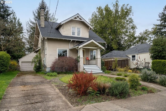 4541 NE 36th Ave, Portland, OR 97211 - view of front of home featuring a chimney, an outdoor structure, a garage, and roof with shingles