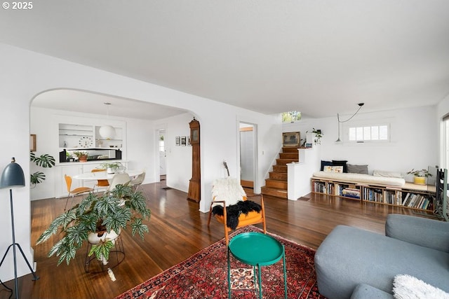 4541 NE 36th Ave, Portland, OR 97211 - living area featuring arched walkways, stairs, and wood finished floors