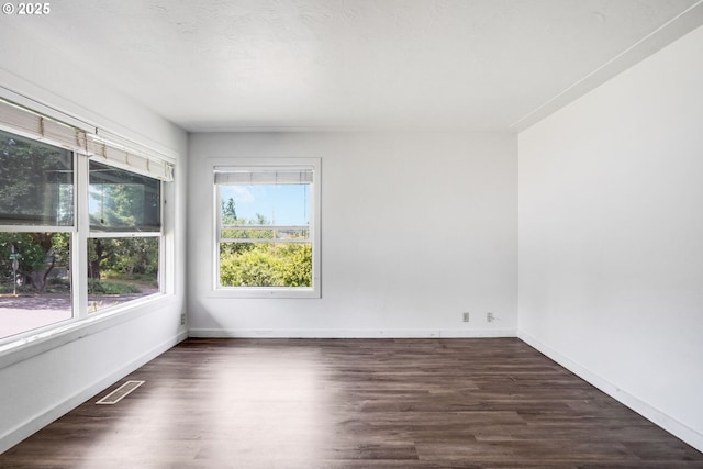 2210 Winter St SE, Salem, OR 97302 - spare room with dark wood-style floors and baseboards