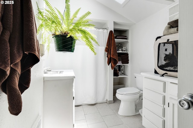 2210 Winter St SE, Salem, OR 97302 - full bathroom featuring tile patterned flooring, a shower with shower curtain, vaulted ceiling, vanity, and built in features