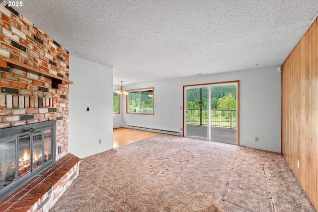 1223 Sable Dr, Roseburg, OR 97470 - unfurnished living room with a baseboard radiator, carpet flooring, a fireplace, a chandelier, and wood walls