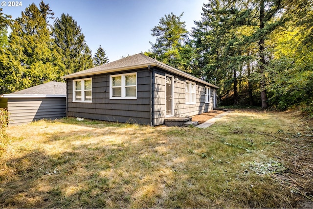 view of home's exterior with a yard