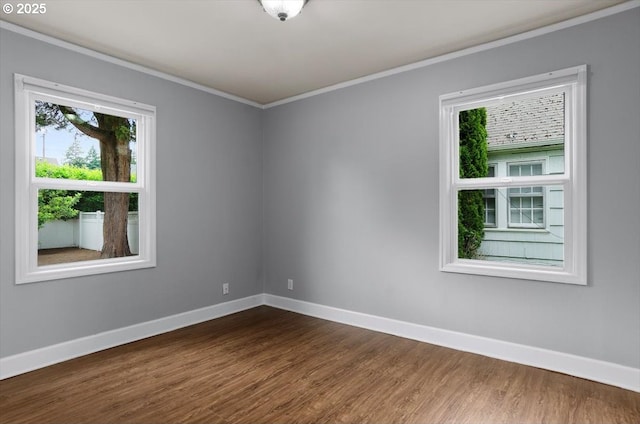8835 NE Broadway, Portland, OR 97220 - empty room featuring ornamental molding, baseboards, and dark wood finished floors