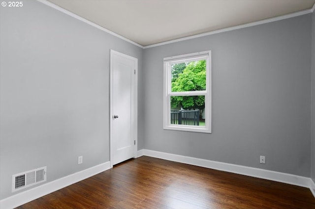 8835 NE Broadway, Portland, OR 97220 - empty room with crown molding, baseboards, and dark wood-type flooring