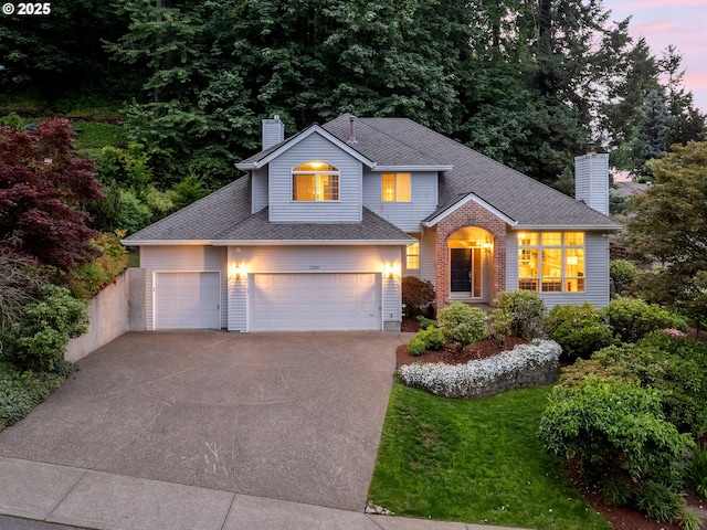1354 Skye Pkwy, West Linn, OR 97068 - traditional-style home featuring a chimney, concrete driveway, roof with shingles, and a front yard