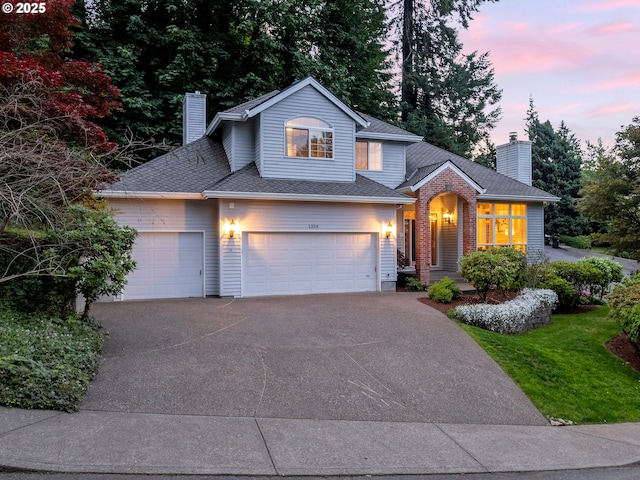 1354 Skye Pkwy, West Linn, OR 97068 - traditional-style home featuring concrete driveway, a garage, a chimney, and roof with shingles
