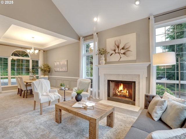 1354 Skye Pkwy, West Linn, OR 97068 - living room with a chandelier, a tile fireplace, plenty of natural light, a tray ceiling, and recessed lighting