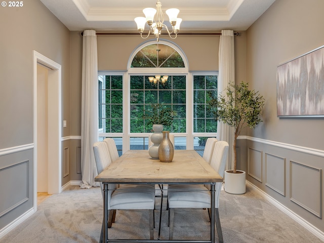 1354 Skye Pkwy, West Linn, OR 97068 - dining area featuring a chandelier, plenty of natural light, light colored carpet, a raised ceiling, and crown molding