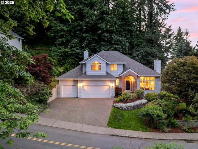 1354 Skye Pkwy, West Linn, OR 97068 - traditional-style home with concrete driveway, a chimney, a garage, and a yard