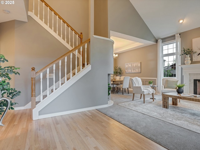1354 Skye Pkwy, West Linn, OR 97068 - foyer with stairway, wood finished floors, a towering ceiling, and a fireplace