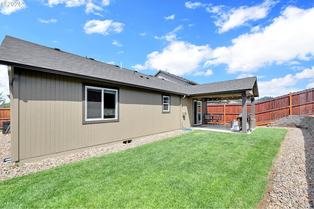 2057 S 59th St, Springfield, OR 97478 - back of house with a patio area, a fenced backyard, and a shingled roof