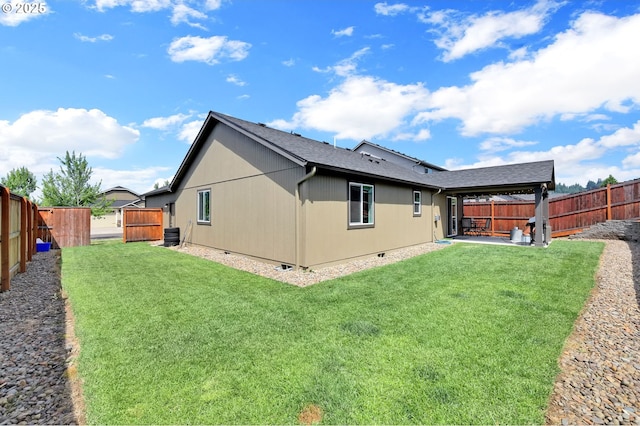 2057 S 59th St, Springfield, OR 97478 - back of property with a fenced backyard and a patio