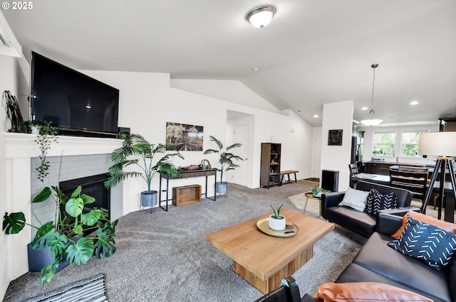 2057 S 59th St, Springfield, OR 97478 - living room featuring carpet floors, vaulted ceiling, a brick fireplace, and recessed lighting