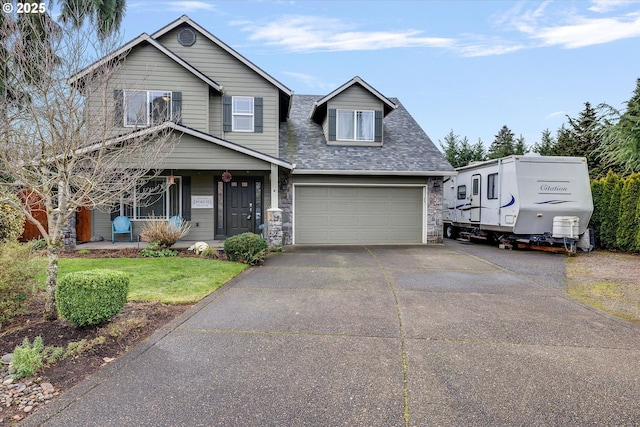 view of front of house featuring a shingled roof, stone siding, driveway, and a front lawn