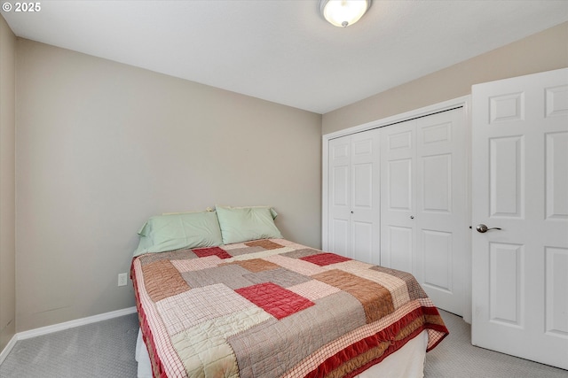 bedroom with carpet floors, a closet, and baseboards