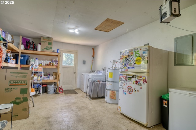 laundry area featuring water heater, laundry area, washer and clothes dryer, and electric panel