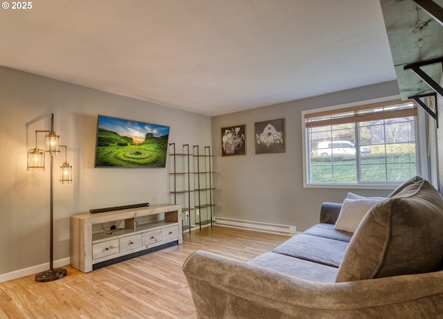 living room with baseboards, baseboard heating, and wood finished floors