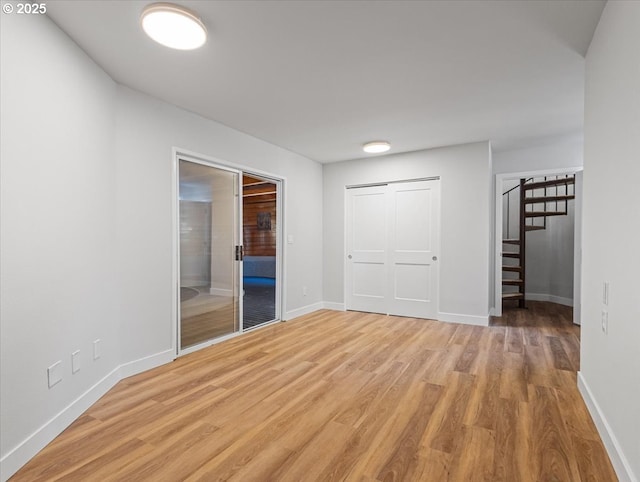 9995 SW Siuslaw Ln, Tualatin, OR 97062 - unfurnished bedroom with light wood-style flooring and a closet