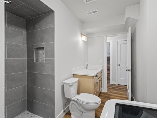 9995 SW Siuslaw Ln, Tualatin, OR 97062 - bathroom with wood finished floors, vanity, and tiled shower