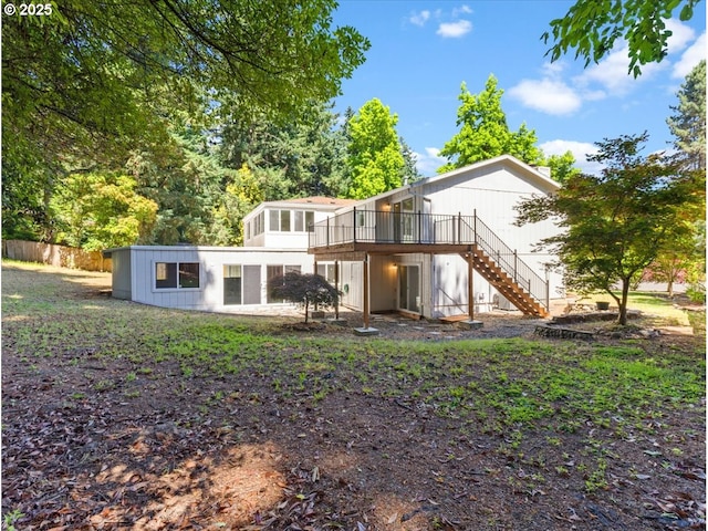 9995 SW Siuslaw Ln, Tualatin, OR 97062 - rear view of house featuring stairs and a wooden deck