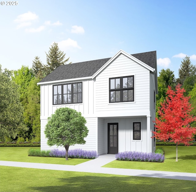 modern farmhouse featuring a front lawn, board and batten siding, and a shingled roof