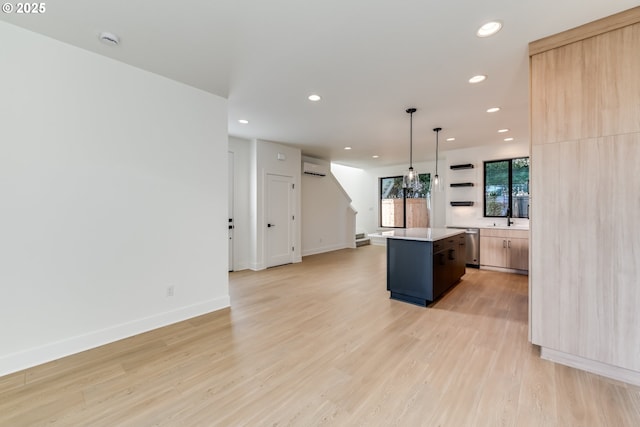 kitchen with open shelves, light countertops, hanging light fixtures, light wood-style floors, and a kitchen island