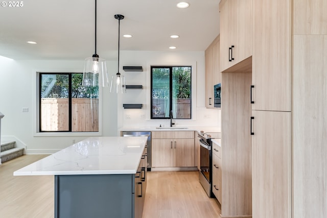 kitchen with pendant lighting, stainless steel appliances, light brown cabinets, a kitchen island, and light stone countertops