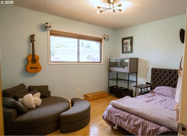 2280 NW 5th St, Gresham, OR 97030 - bedroom featuring an inviting chandelier, a textured ceiling, and wood finished floors