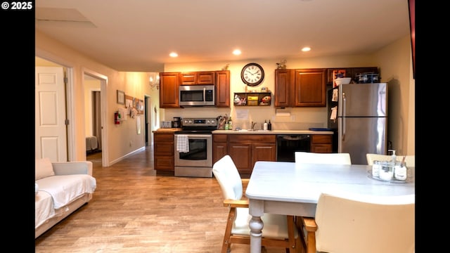 2280 NW 5th St, Gresham, OR 97030 - kitchen with recessed lighting, light countertops, light wood finished floors, and appliances with stainless steel finishes