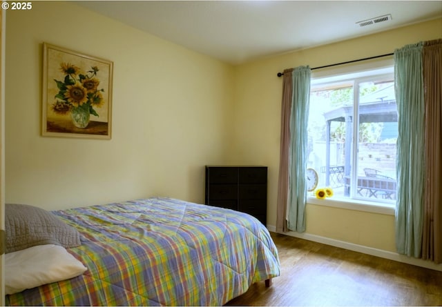 2280 NW 5th St, Gresham, OR 97030 - bedroom with visible vents, baseboards, and wood finished floors