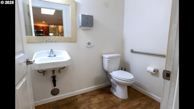 2280 NW 5th St, Gresham, OR 97030 - bathroom with toilet, baseboards, and wood finished floors