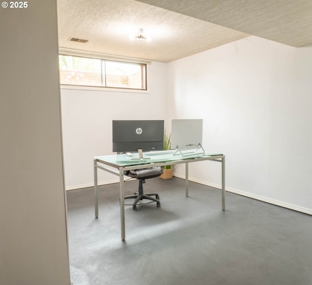 2280 NW 5th St, Gresham, OR 97030 - home office featuring baseboards, concrete floors, a textured ceiling, and visible vents